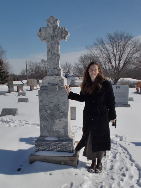 Father Mazzuchelli Society founder Elizabeth Durack at the grave of Samuel Mazzuchelli in Benton Wisconsin, on February 23, 2012, the anniversary of his death